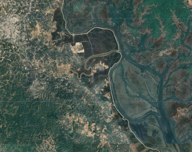 Satellite view of settlements, vegetation, and winding waterways